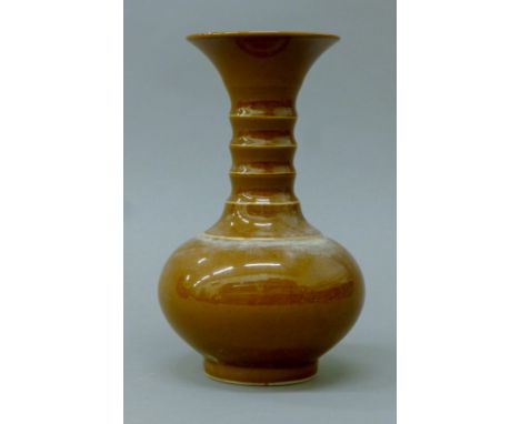 A Chinese brown glazed porcelain vase. 24 cm high.