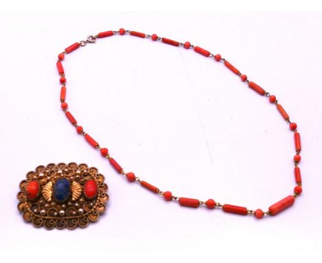 A coral necklace and a coral and lapis lazuli set brooch.  Brooch 5 x 4 cm, necklace 44 cm long.