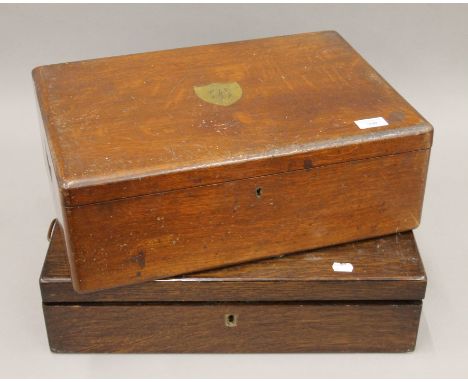 Two canteens containing silver-plated cutlery, one canteen box with label for Walker & Hall. The largest 49 cm wide.