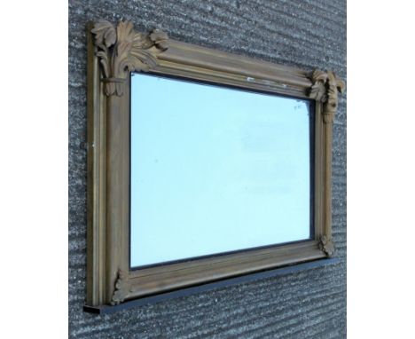 A large 19th century gilt over-mantle mirror. 160 cm wide x 90 cm high.