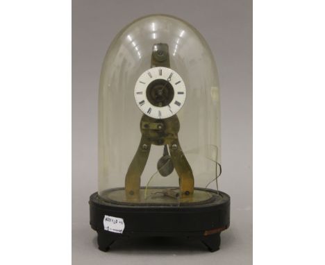 A brass skeleton clock under a glass dome (damaged). 25 cm high.