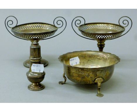A pair of silver bonbon dishes, a silver bowl and a pepper. The former each 12 cm high. 14.3 troy ounces.