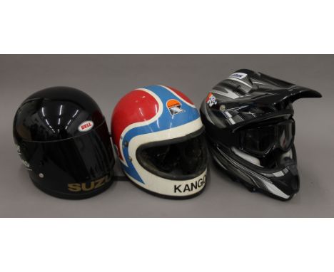 Two vintage motorcycle helmets, a modern one motorcycle helmet and gloves. The latter 39 cm long.