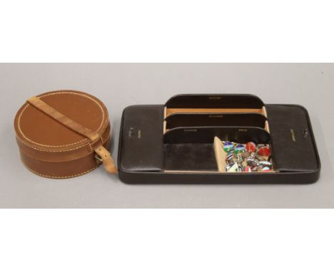A gentleman's leather vanity case with collar box and cufflinks, including silver. The former 32 cm wide.