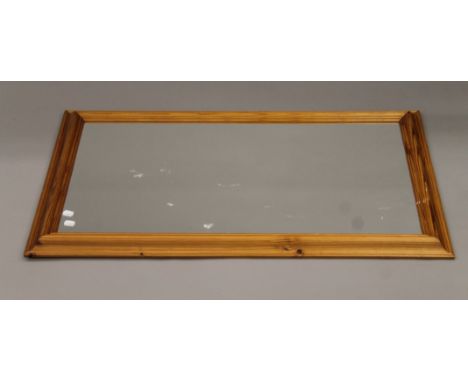 A modern pine mirror. 102 x 61 cm.