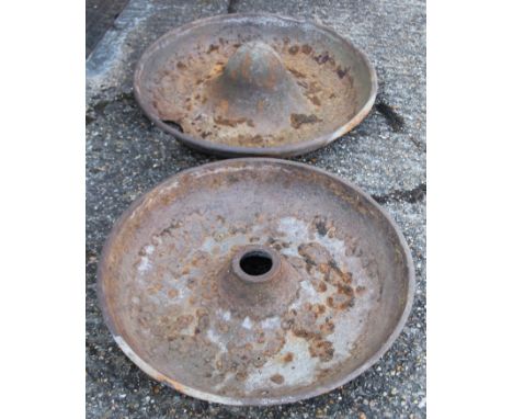 Two large Mexican hat cast iron pig feeders. 82 cm diameter. 