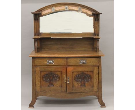 An Arts and Crafts oak mirror-back sideboard. 123 cm wide x 170 cm high.