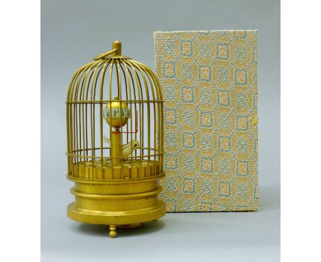 A birdcage clock. 15 cm high.