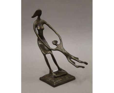 A bronze abstract figural group. 29 cm high.