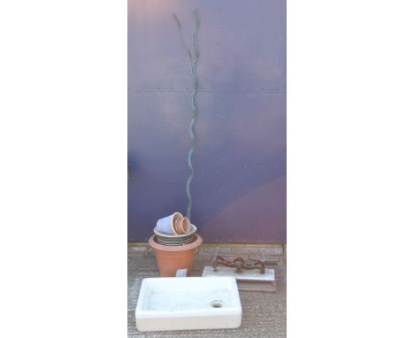 A shallow two colour glazed sink, three spiral plastic coated plant supports, a set of marble and wood cast iron scales and a