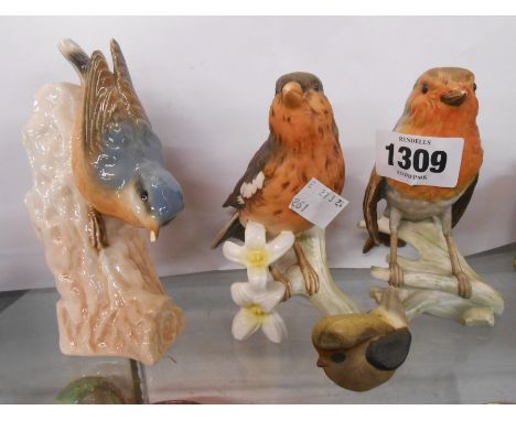 A Goebel pottery robin figurine with matte glaze finish, a similar finch and a gloss finish treecreeper (a/f) - sold with a s