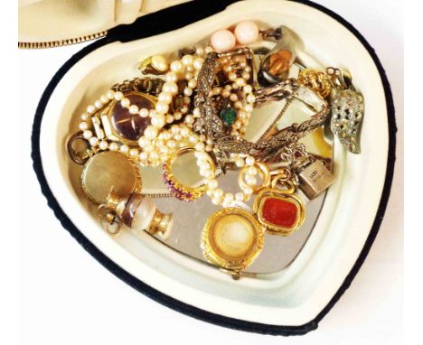 A heart shaped jewellery box containing jewellery including swivel fob, ring, lockets, pearl necklace and a silver inkwell ch