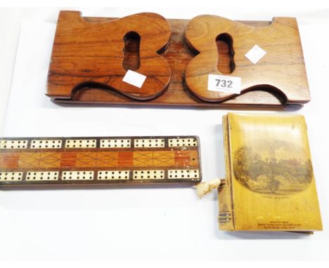 A 19th Century rosewood book slide - sold with a small wooden cribbage board with carved decoration and bone inlay and a smal