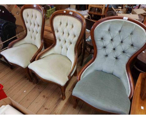 A pair of modern part show frame spoonback chairs and another similar, all with button back pale frosted green velour upholst