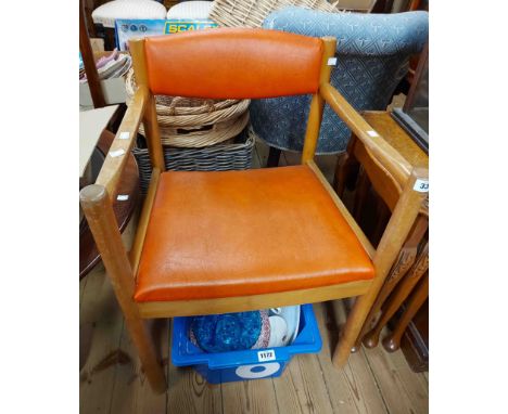 An Ercol light elm framed elbow chair with orange vinyl upholstered back and seat, set on simple turned supports - bearing go