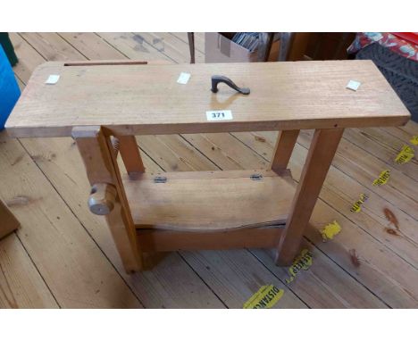 A 60cm vintage child's workbench with lift-top compartment to undertier containing a small quantity of hand tools