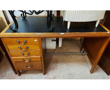 A 1.21m vintage stained mixed wood single pedestal desk with inset top and flight of five pedestal drawers, set on square sup