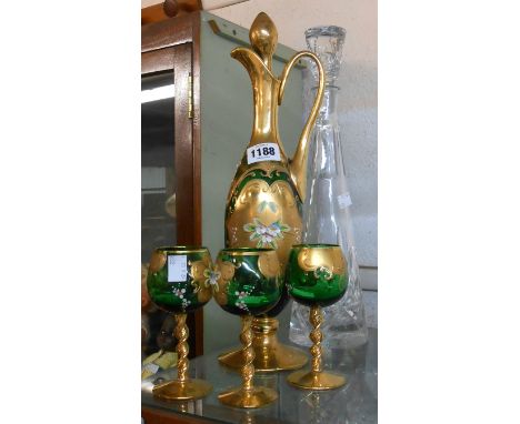 A vintage Murano green glass decanter and three glasses, with gilt and enamel decoration - sold with a tall cut glass decante
