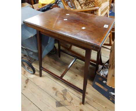 A 53cm Edwardian mahogany and strung fold-over card table with green baise, set on splayed square tapered supports