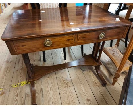 A 66cm Victorian mahogany side table with two frieze drawers and opposing dummy drawer fronts, set on ring turned supports an