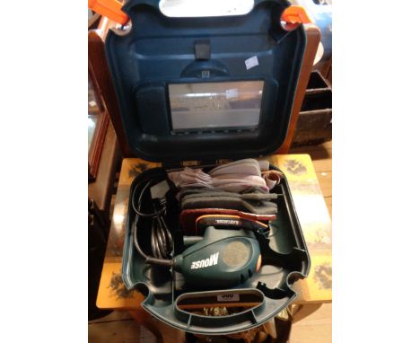 A cased Black &amp; Decker 'Mouse' sander with a quantity of sanding pads
