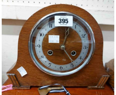 A vintage oak cased mantel clock, with English eight day gong striking movement