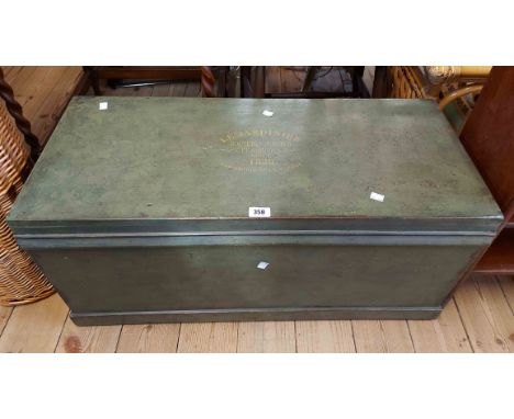 An 87cm French painted mixed wood lift-top trunk with flanking iron drop handles and text to lid 'Le Jardinier, etc.'