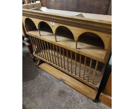 A 1.05m pine plate rack with arcaded top, stick set rack and shelf under