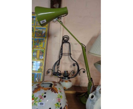 A vintage Herbert Terry &amp; Sons anglepoise lamp with round cushion base and avocado green finish