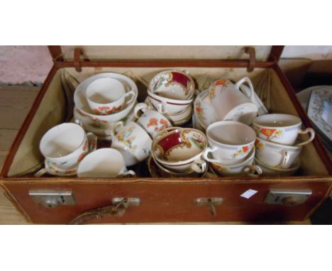 A Grindley pottery part tea set, a Myott pottery similar and a Heathcote bone china part tea set contained in an old fibreboa