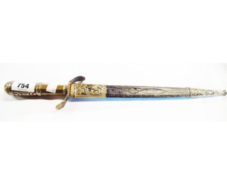 An old dagger with silver metal and brass handle, the brass hilt with silvered metal embossed floral decoration with leather 