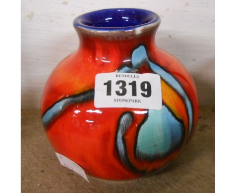 A late 20th Century Poole Pottery vase of short globular form decorated with an Adelphis style design in bold colours