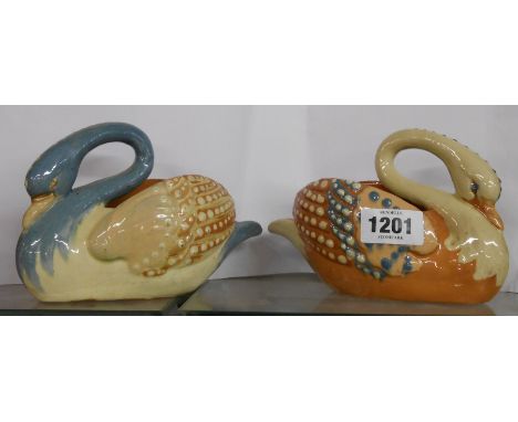 A 19th Century C.H. Brannam Art Pottery swan form posy vase, with coloured slip decoration - sold with another restored simil