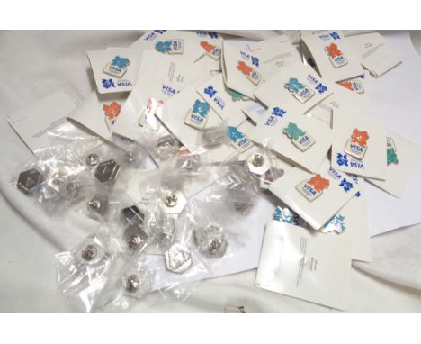 A bag containing a quantity of enamel badges commemorating the 2012 Olympics made for Visa International