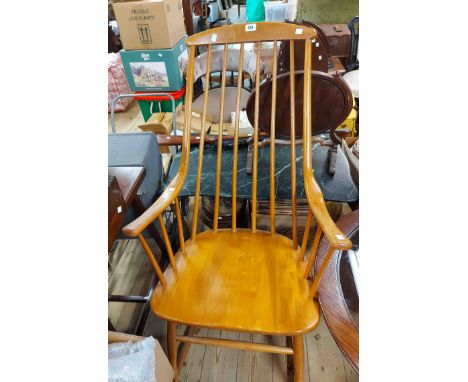 A modern stained and polished wood high stick back rocking chair with moulded sectional seat - sold with a child's wicker elb