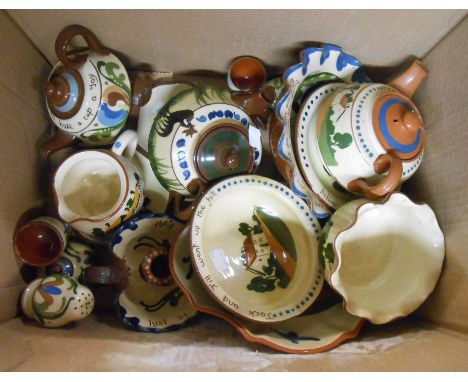 A box containing a quantity of Torquay motto ware including teapots, bowls, inkwell, candlestick, etc. - various makers inclu