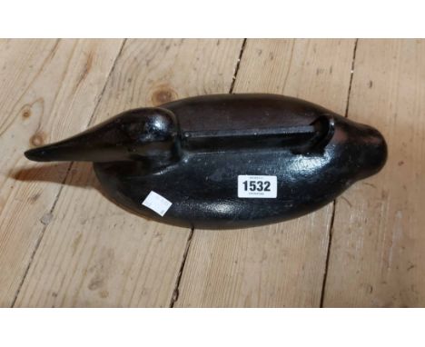 A vintage duck pattern boot scraper with black painted finish