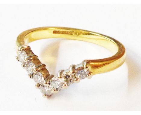 A diamond set wishbone pattern ring A 750 (18ct.) gold diamond set wishbone pattern ring - size J 1/2