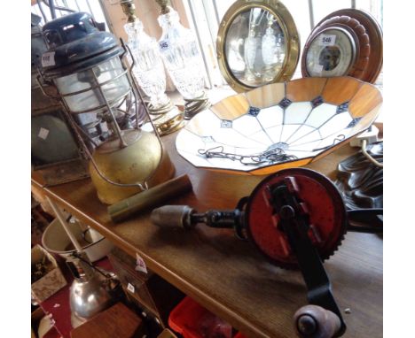 An old Tilley lamp with enamel top and glass shade - sold with a vintage hand drill and a set of three vintage wood and brass