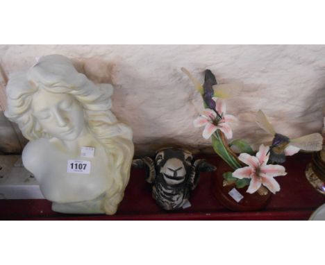 A studio pottery wall mask in the form of a ram's head, a modern ceramic bust depicting a lady in the Art Nouveau style and a