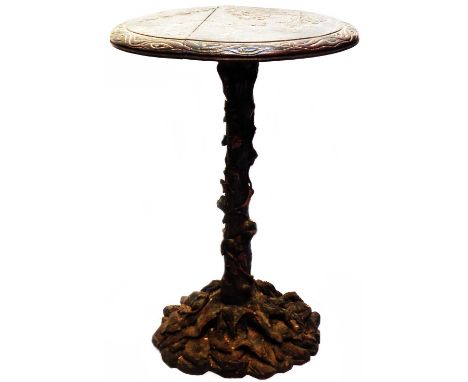 A 50cm antique carved oak pedestal table with clog wearing country couple walking towards a cottage in a stylised woodland se