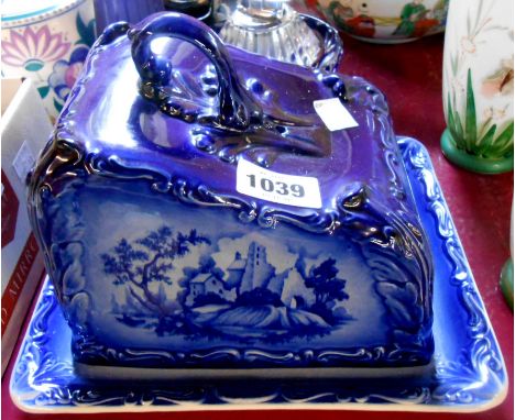 A modern ceramic cheese dish of wedge form with blue and white transfer printed decoration