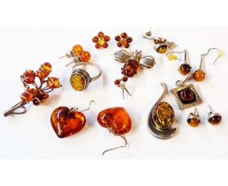 A bag containing a collection of 925 and other white metal jewellery, all mounted with honey amber comprising earrings, brooc