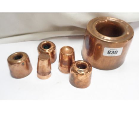A Victorian copper jelly mould of tall ring form - sold with three smaller similar and a small quantity of miniature moulds