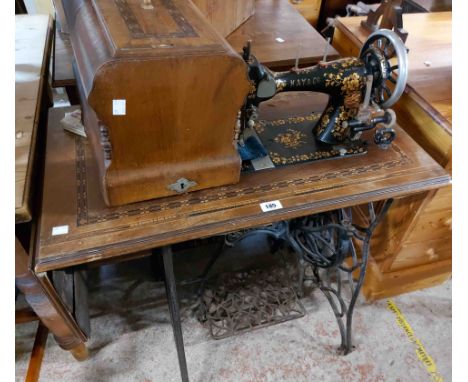 A late 19th Century Kay &amp; Co. sewing machine with highly decorated floral finish and text 'Made in Baden'. with inlaid co