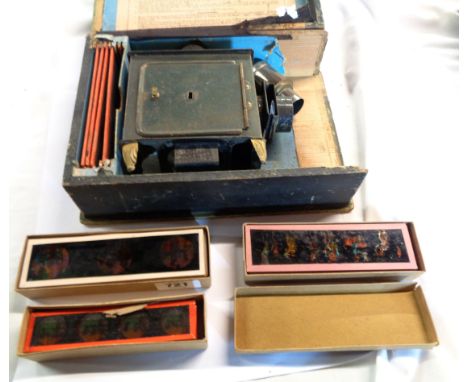 An antique tin plate Magic Lantern in original wooden box (box a/f) - sold with a boxed set of Indcol coloured magic lantern 