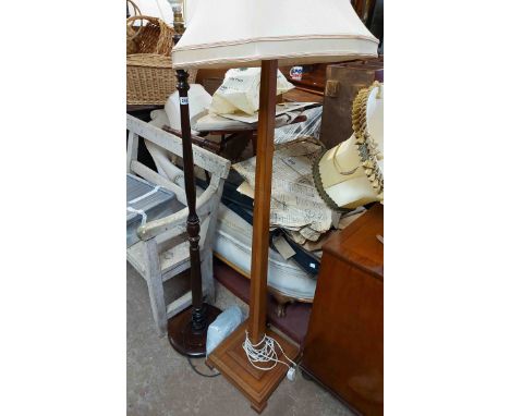 A vintage stained wood standard lamp with square tapered pillar and platform base - sold with a later similar - both with sha