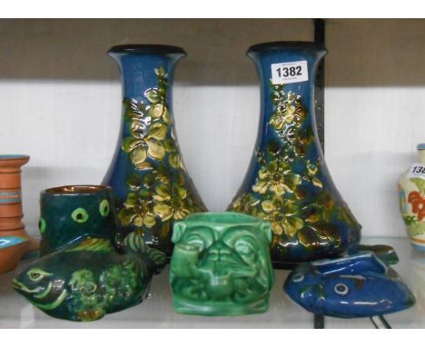 A quantity of Torquay pottery items comprising Aller Vale fish form vase with coloured slip decoration on a dark green ground