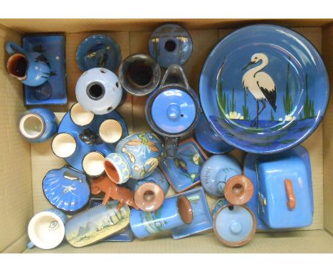 A box containing a quantity of mainly blue ground Torquay pottery items including bowls, jugs, candlestick, hair tidy, etc. -