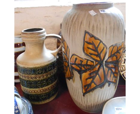 A large vintage West German pottery vase with moulded leaf decoration on a textured and matte glaze ground, a smaller similar